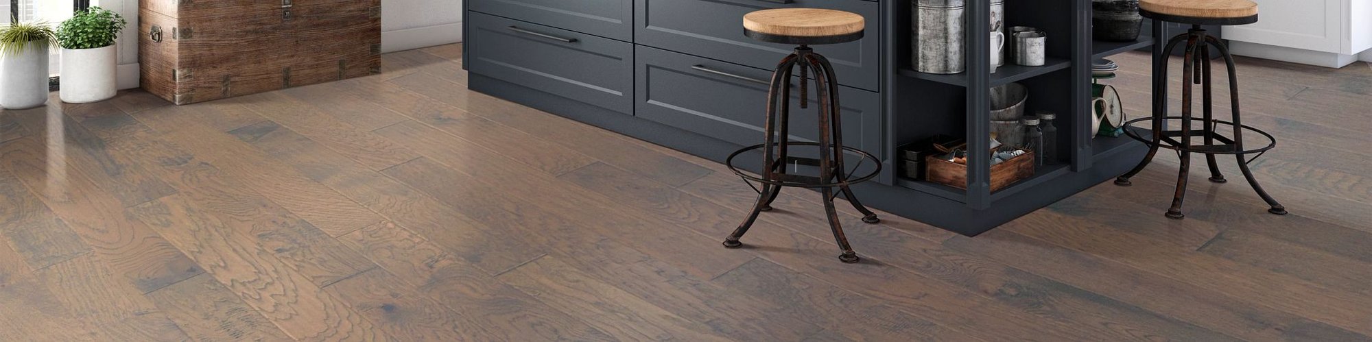bar stools in kitchen with hardwood flooring